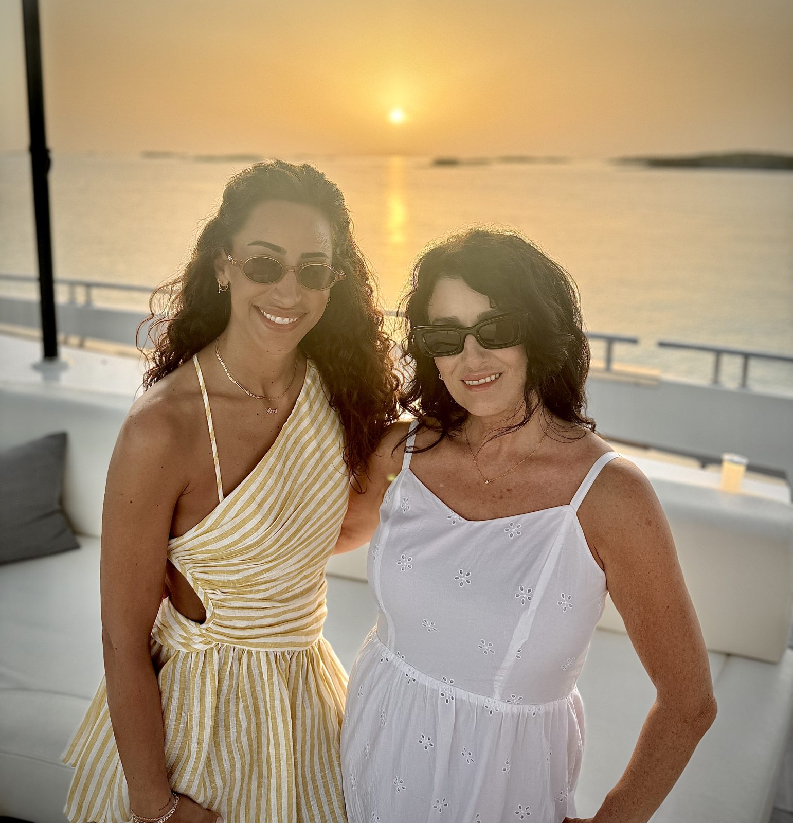 Denise Jonas and Dani at sunset on the water